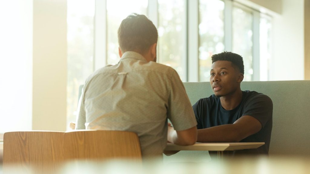 two men talking