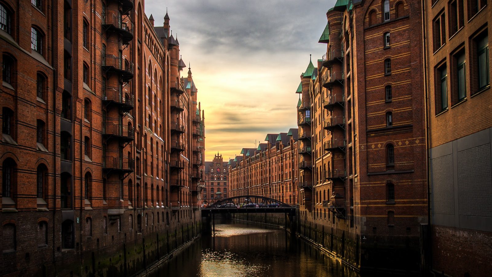 river between brown concrete buildings